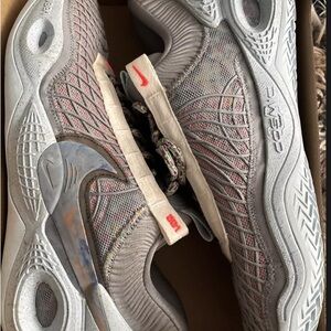Nike Cosmic Unity: Gray and Red Athletic Shoes